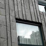 Bestand: vorgehängte Fassade aus Gneisplatten